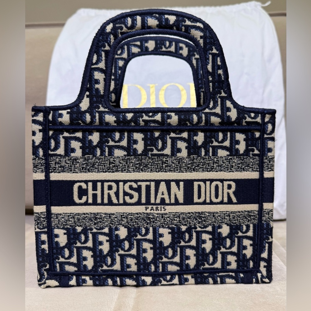 Bag Dior, Navy Blue, NWT, 
size 9.25” x 3.25” x 7.0” fabric